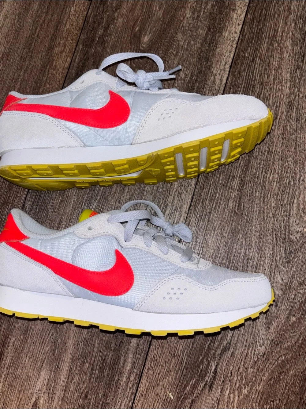 Nike Kids White Sneakers with Neon Pink Swoosh and Yellow Outsole
